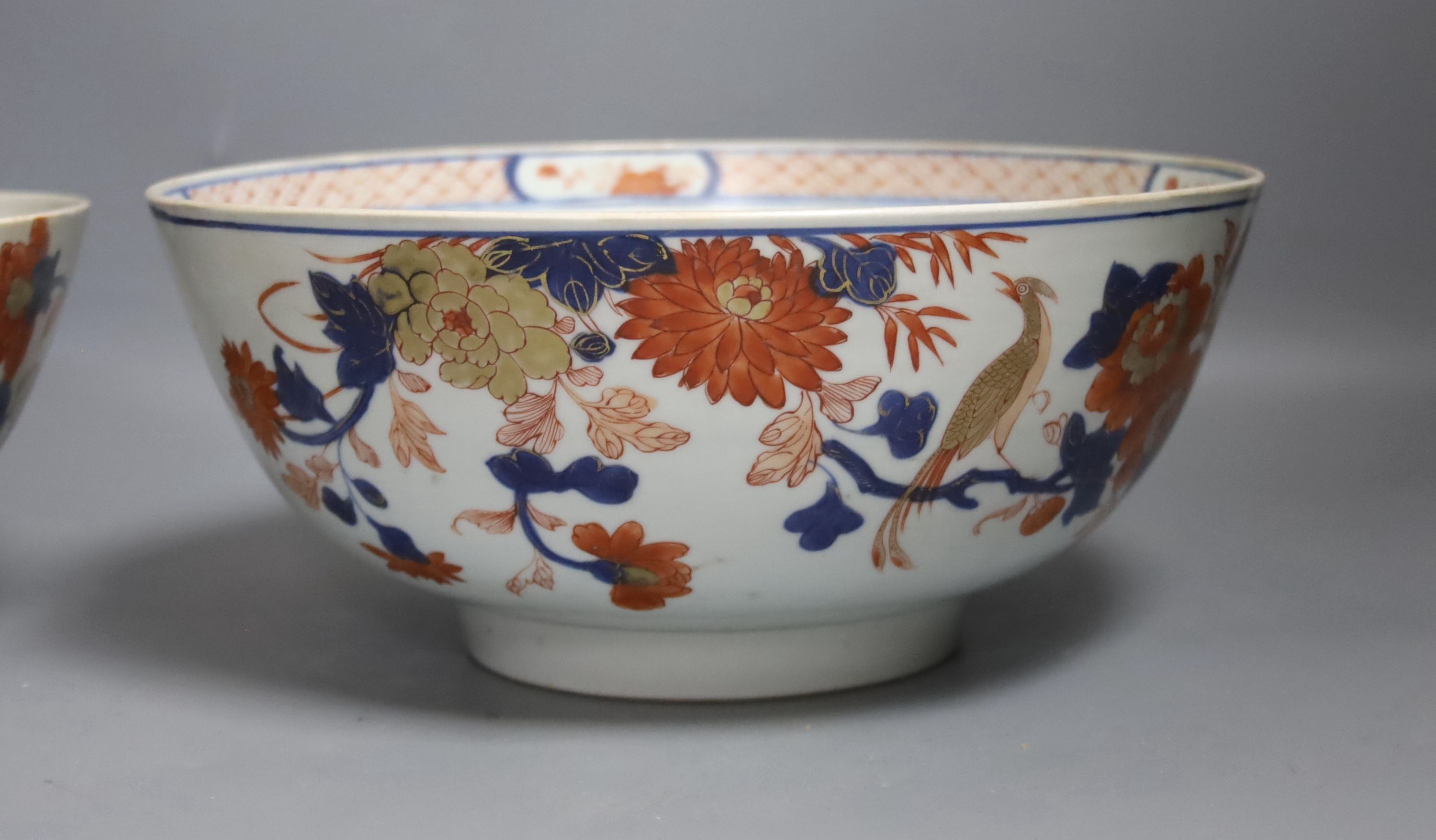 Three 18th century Chinese export porcelain bowls, largest 28 cm and two plates